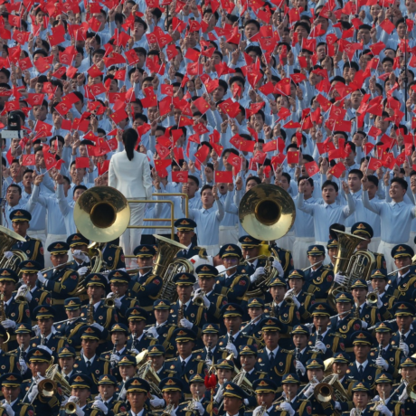 A military band and flag-waving participants in the Chinese 2025 Victory Parade. Photo: Kremlin.ru