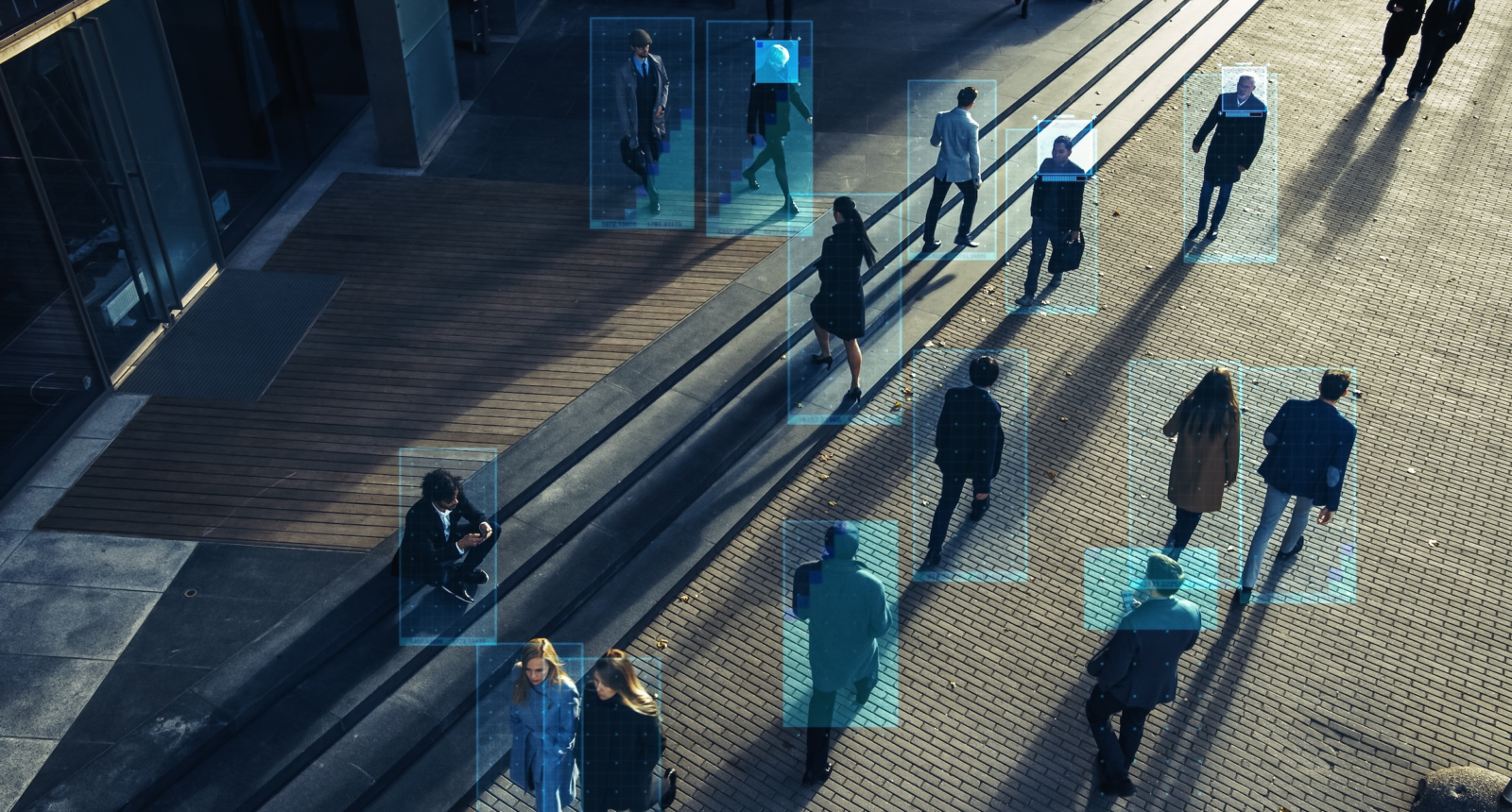 Elevated Security Camera Surveillance Footage of a Crowd of People Walking on Busy Urban City Streets. CCTV AI Facial Recognition Big Data Analysis Interface Scanning, Showing Personal Information.