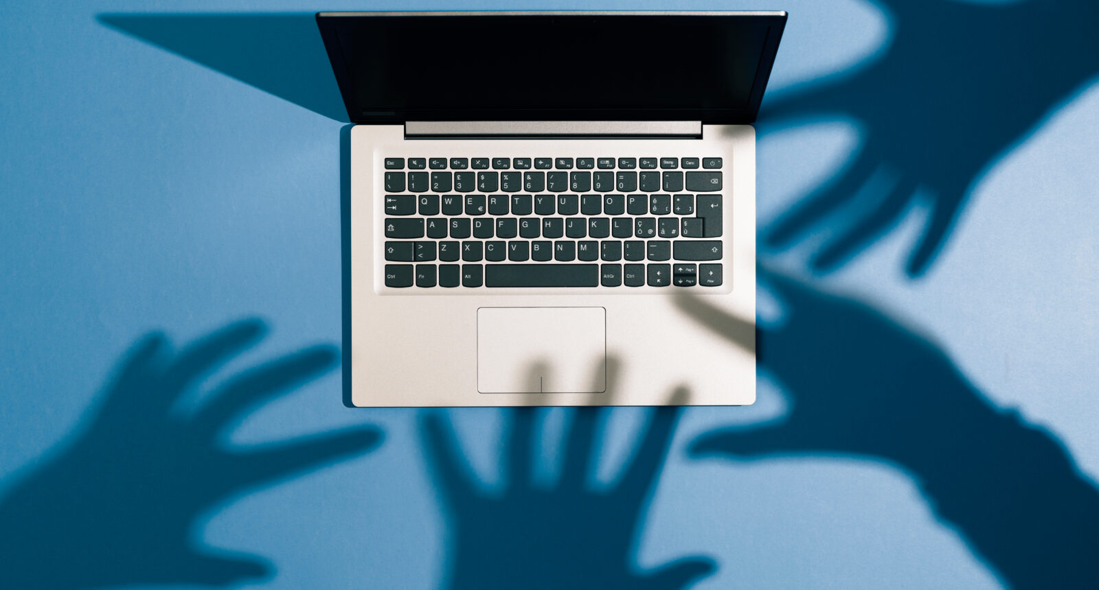 Threatening,Hands,Attacking,A,Laptop,And,Stealing,Information:,Cyber,Crime,