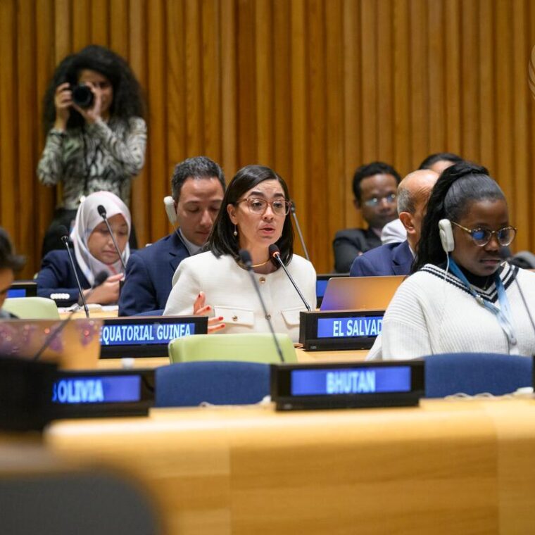Egriselda Aracely González López (centre of photo), Permanent Representative of El Salvador to the United Nations, addresses the informal meeting of the General Assembly plenary on the implementation of the Global Compact on Safe, Orderly and Regular Migration. At right is Deputy Secretary-General Amina Mohammed.